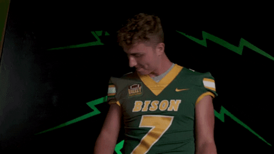 Ndsu Football Player Joggling Oval Shaped Ball GIF