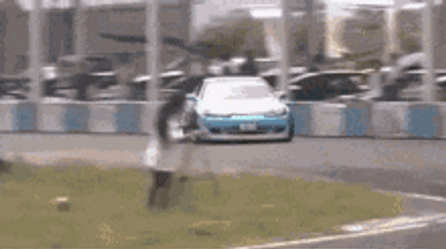 Neon Painted Race Car Drifting Inside Race Track GIF