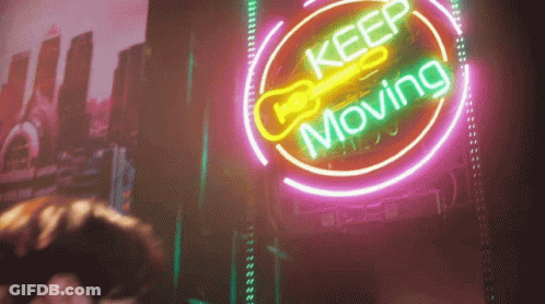 Neon Sign Saying Keep Moving GIF