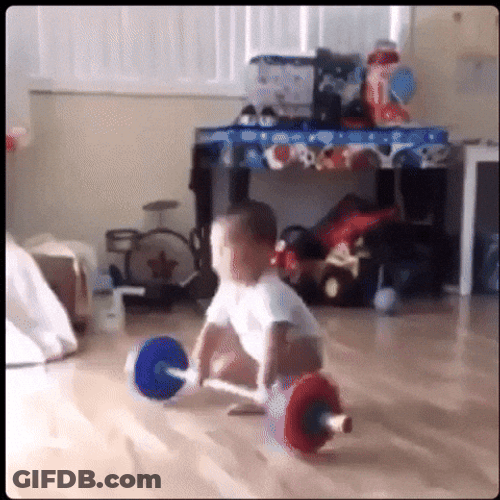 Nepo Baby Playing Barbell Toy GIF