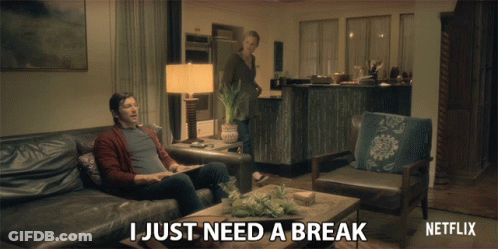 Netflix Ad Man Sitting On Couch Woman Behind GIF