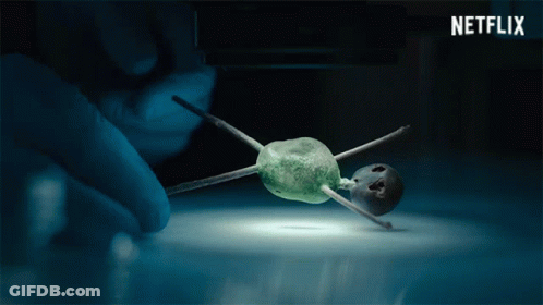 Netflix Ad Person Holding Tiny Object GIF