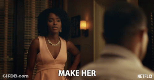 Netflix Ad Woman In Pink Dress Looking At Man GIF