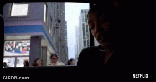 Netflix Ad Woman Looking Out Window GIF