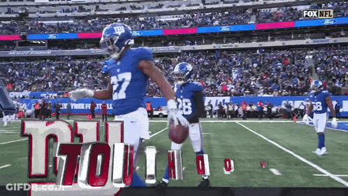 New York Giants Football Player Holding Football GIF