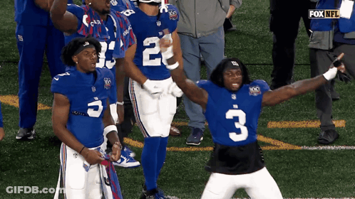 New York Giants Players Number 2 And 3 Are Celebrating On The Field GIF