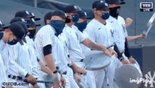 New York Yankees Baseball Players Wearing Masks Holding Bats GIF