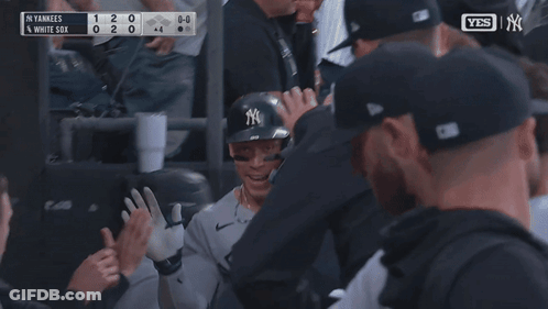 New York Yankees Player Surrounded By Teammates GIF