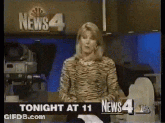 News Anchor In Front Of News 4 Sign GIF