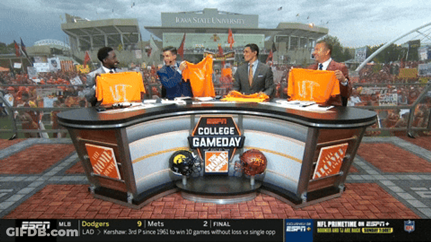 News Casters Holding Up Rocky Top Jersey GIF