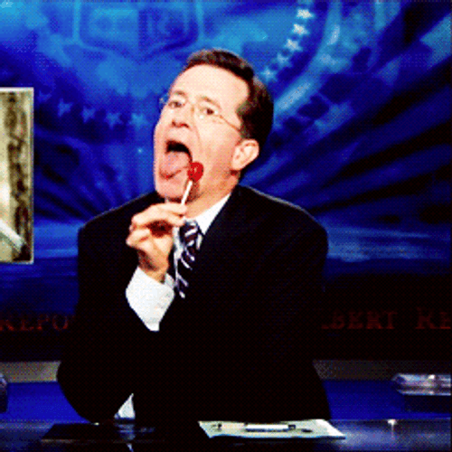News Reporter Eating Lollipop In A Flirt Way GIF