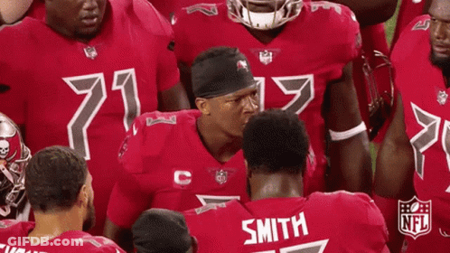 NFL Players Huddled With Smith Jersey GIF
