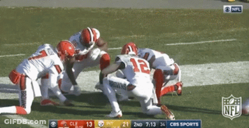 NFL Players Kneeling On Field GIF