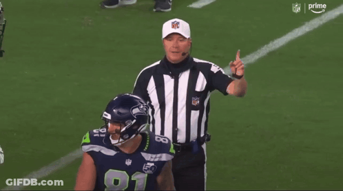 NFL Referee Pointing At Football Player Number 11 GIF