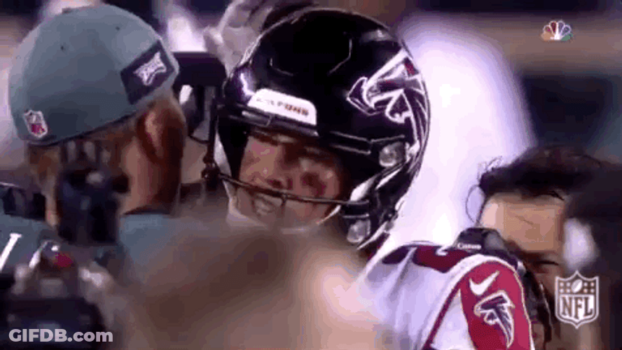 Nick Foles Interacting With Atlanta Falcons Player GIF