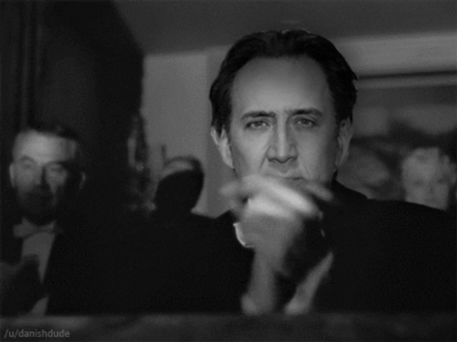 Nicolas Cage Monotone Blank Stare Clapping GIF