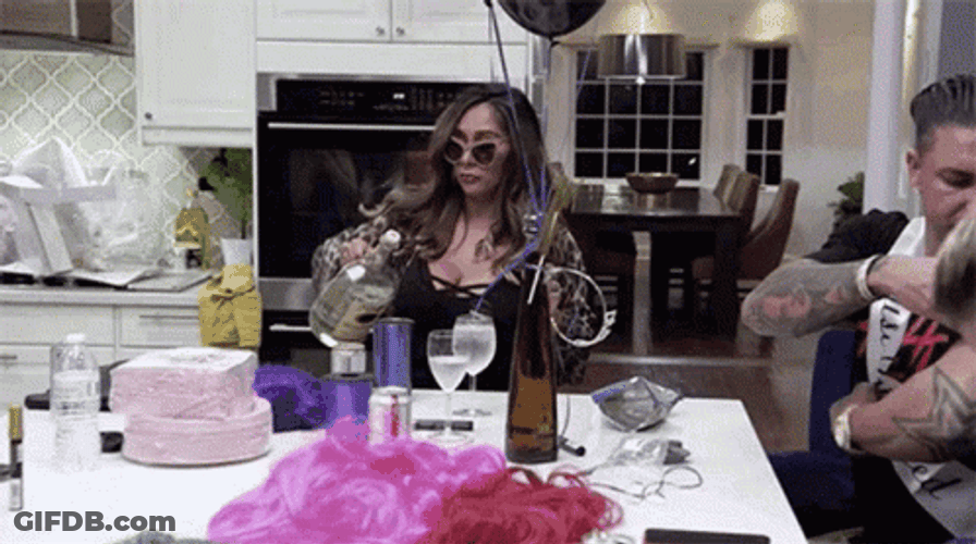 Nicole Polizzi Pouring Two Shots Of Vodka GIF