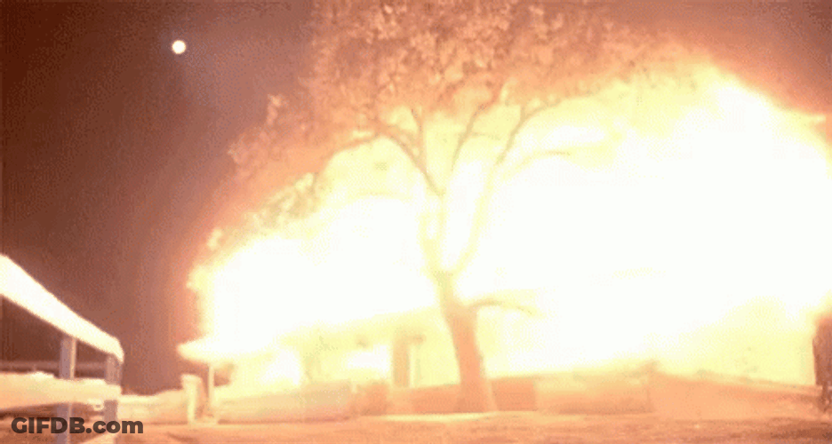 Nighttime Bomb Explosion Illuminating The Sky GIF