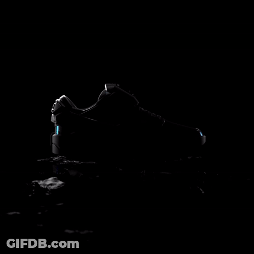 Nike Black And White Shoe With Blue Swoosh GIF