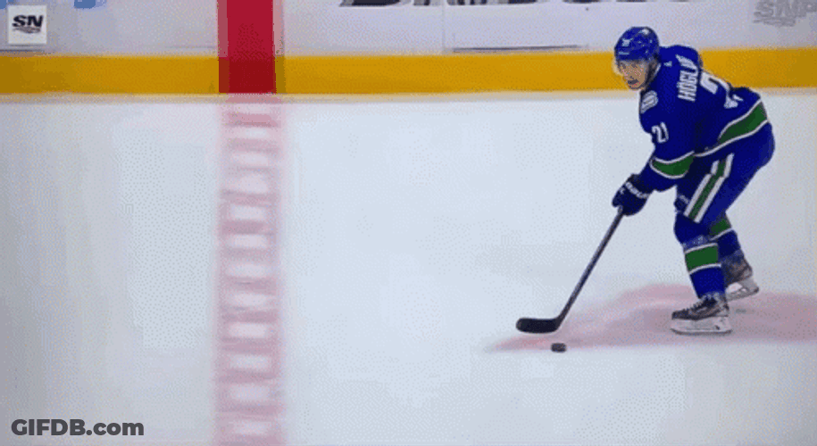 Nils Hoglander Bumping Player In Hockey Game GIF