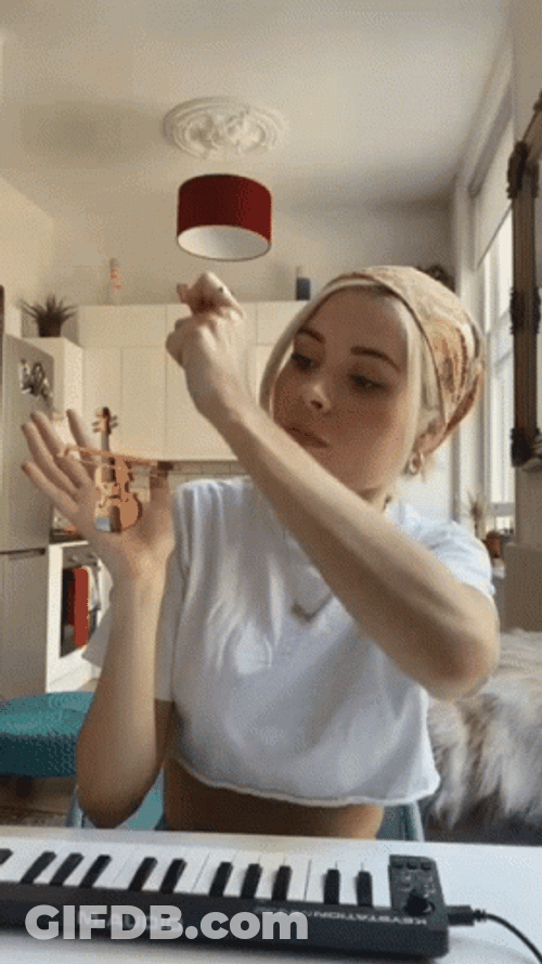 Nina Nesbitt Playing Smallest Violin GIF
