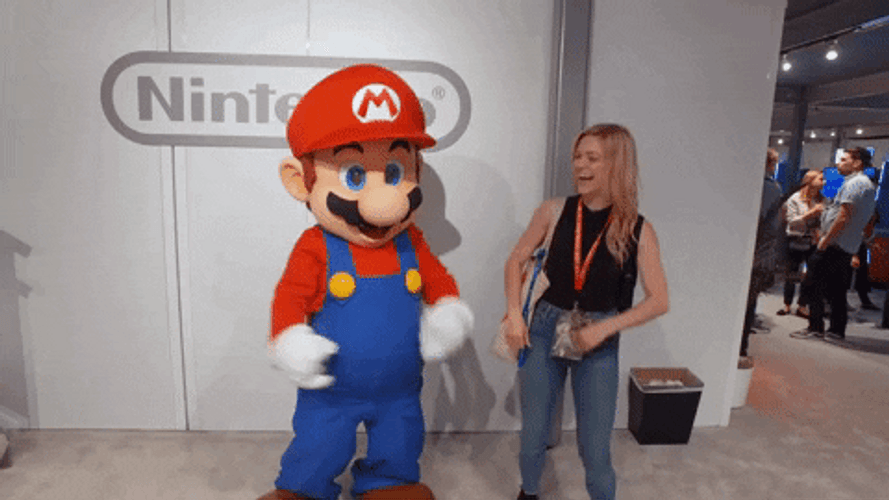 Nintendo Super Mario Mascot Dancing With A Girl GIF