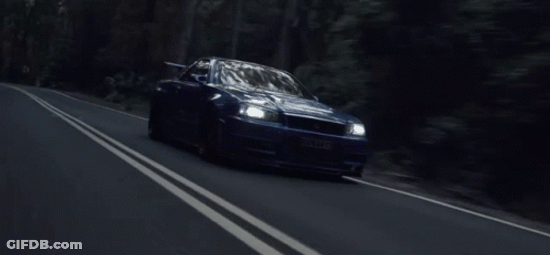 Nissan Skyline R34 Driving Along Highway GIF