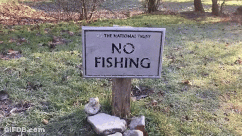 No Fishing Sign In Grass GIF