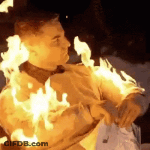 Nonchalant Man On Fire Arms Ablaze GIF