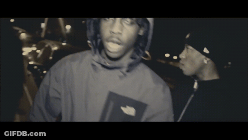 North Face Jacket Man Beside Black Hat Man GIF