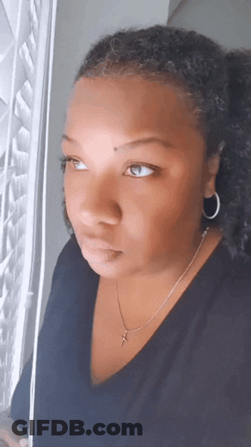 Nosy Woman Looking Out The Window GIF