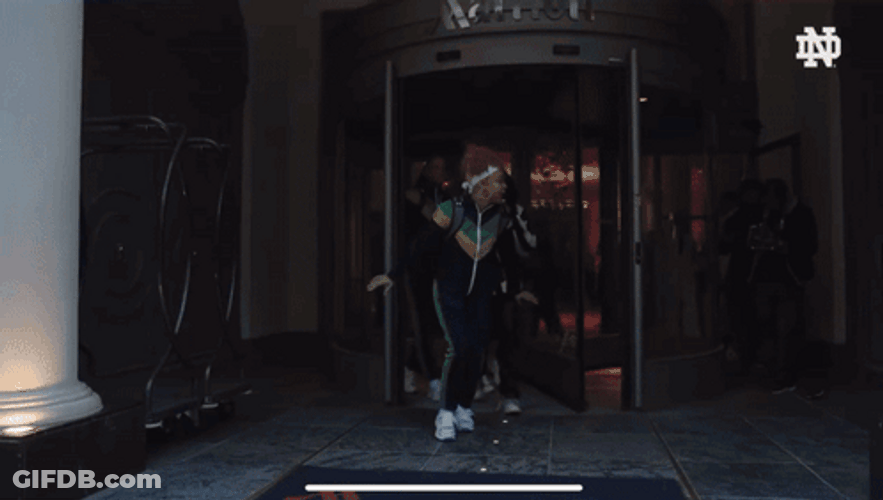 Notre Dame Guy Runs Out GIF