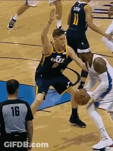 Number 9 Basketball Player Blocking Number 11 Player GIF