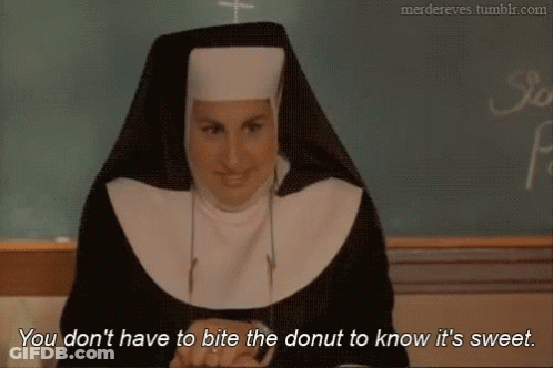 Nun By Chalkboard Says Don't Bite Donut GIF