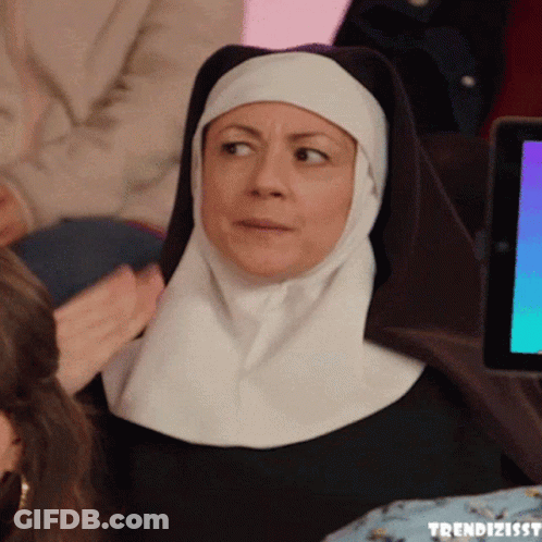 Nun Sitting At Tablet With Trendizisst GIF