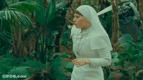 Nun Smoking Cigarette In Jungle GIF