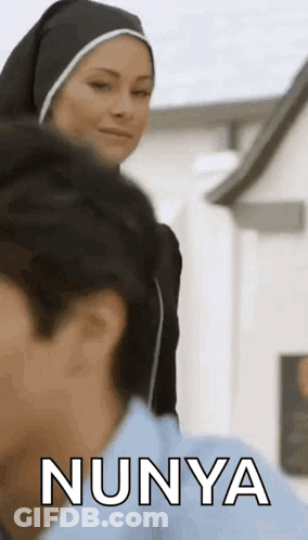 Nun Talking To Man In Blue Shirt GIF