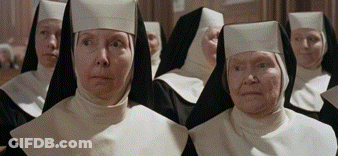 Nuns Standing In A Row Looking At Something GIF