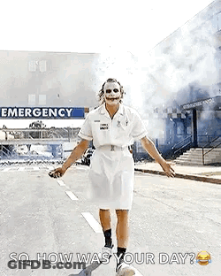Nurse Dressed As Joker Walking In Front Of Emergency Room GIF