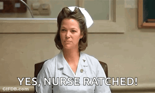 Nurse Dressed As Joker Walking In Front Of Emergency Sign GIF
