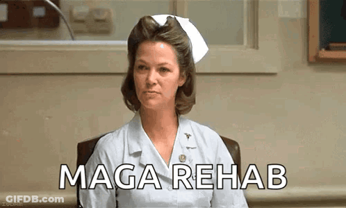Nurse Sitting In Chair With MAGA Rehab Screen GIF