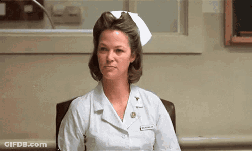 Nurse Sitting In Hospital Chair GIF