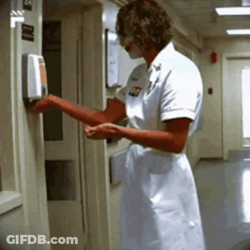Nurse Using Hand Sanitizer GIF