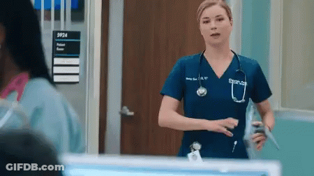 Nurse With Stethoscope In Front Of Sign 5924 GIF