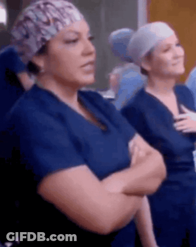 Nurses Standing With Arms Crossed In Scrubs GIF