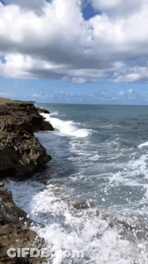 Ocean Waves Hitting Big Rocks GIF