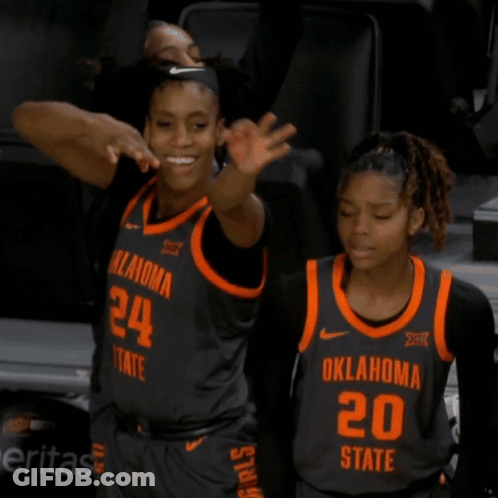 Oklahoma State Basketball Players Wearing Black And Orange Jerseys GIF