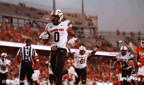 Oklahoma State Football Player Running With Ball GIF