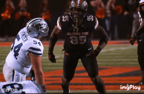 Oklahoma State Football Player Standing On Field GIF