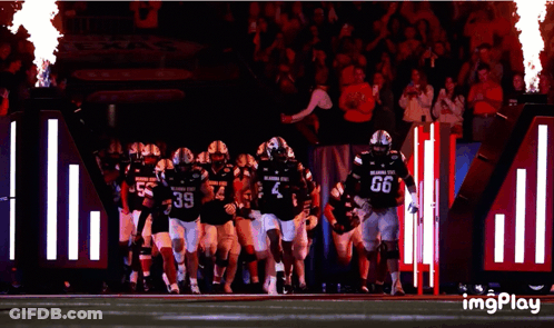 Oklahoma State Football Players Running On Field GIF